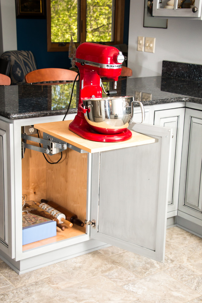 Eat-in kitchen - large transitional u-shaped porcelain tile and beige floor eat-in kitchen idea in Milwaukee with an undermount sink, raised-panel cabinets, gray cabinets, granite countertops, white backsplash, marble backsplash, stainless steel appliances and no island