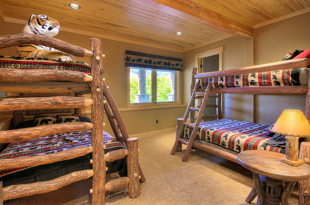 Example of a large mountain style guest carpeted and brown floor bedroom design in Denver with gray walls and no fireplace