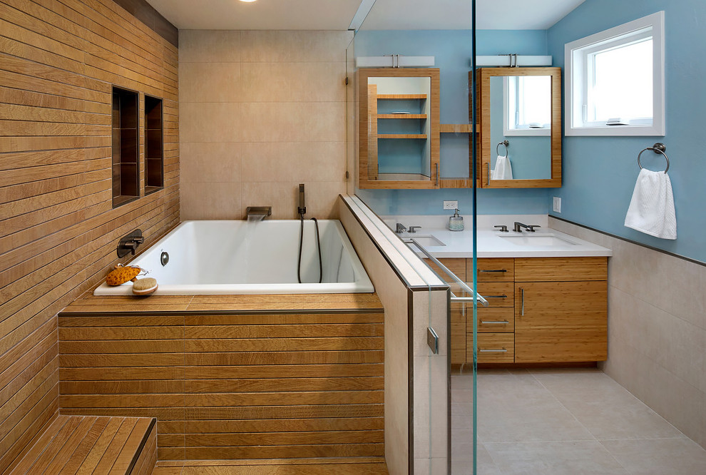 Inspiration for a mid-sized master wet room bathroom in San Francisco with flat-panel cabinets, brown cabinets, a drop-in tub, beige tile, porcelain tile, blue walls, porcelain floors, an undermount sink, beige floor, an open shower and white benchtops.