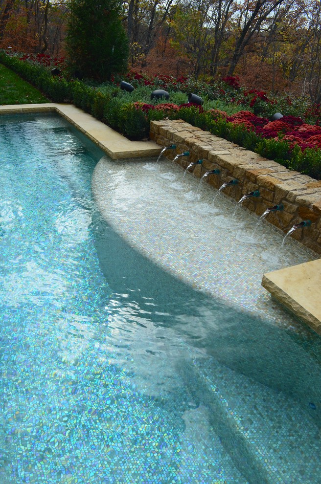 Design ideas for a small mediterranean courtyard custom-shaped lap pool in Kansas City.