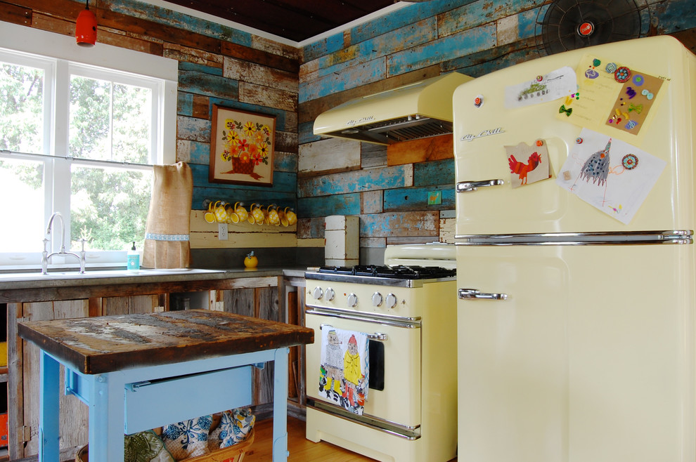 Design ideas for a country l-shaped kitchen in New York with multi-coloured splashback and coloured appliances.