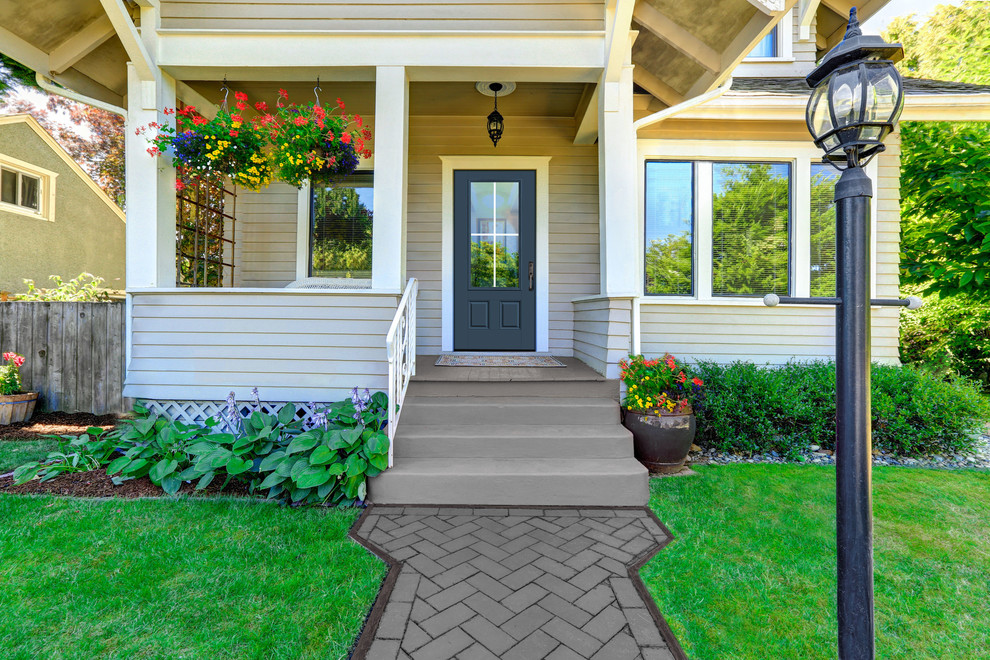 This is an example of a traditional front door in Other with a single front door and a gray front door.