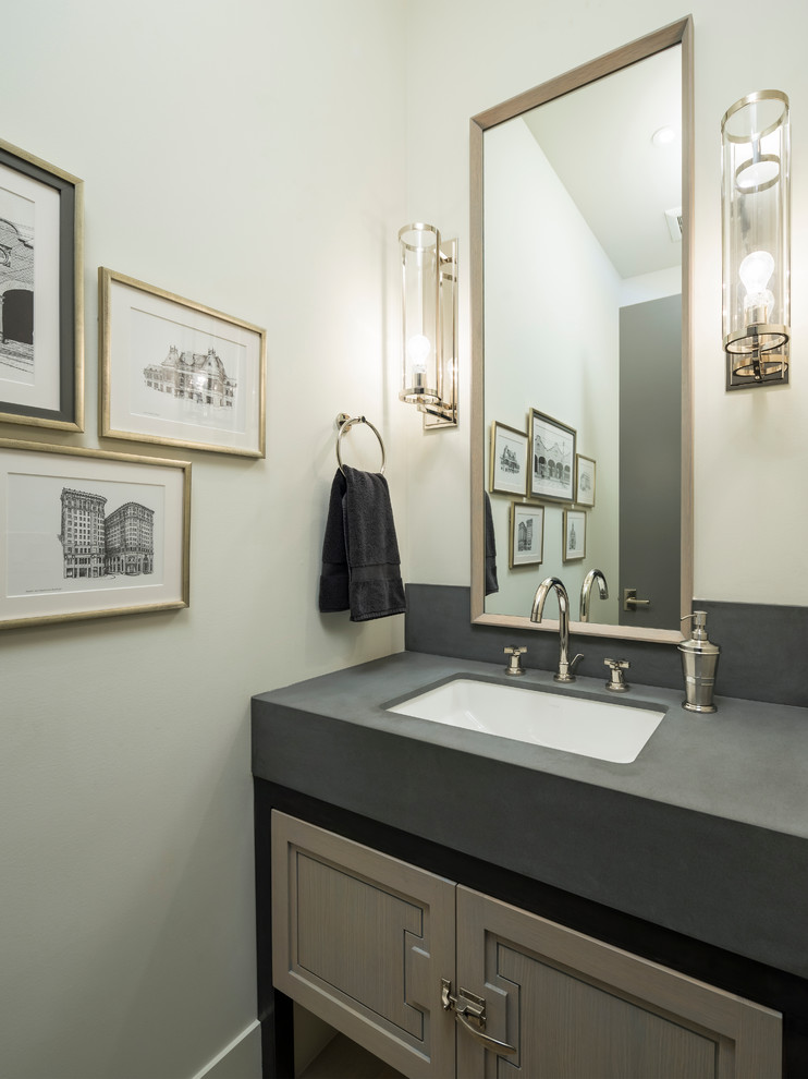 Large contemporary powder room in Salt Lake City with flat-panel cabinets, dark wood cabinets, black tile, ceramic tile, ceramic floors, an undermount sink and soapstone benchtops.