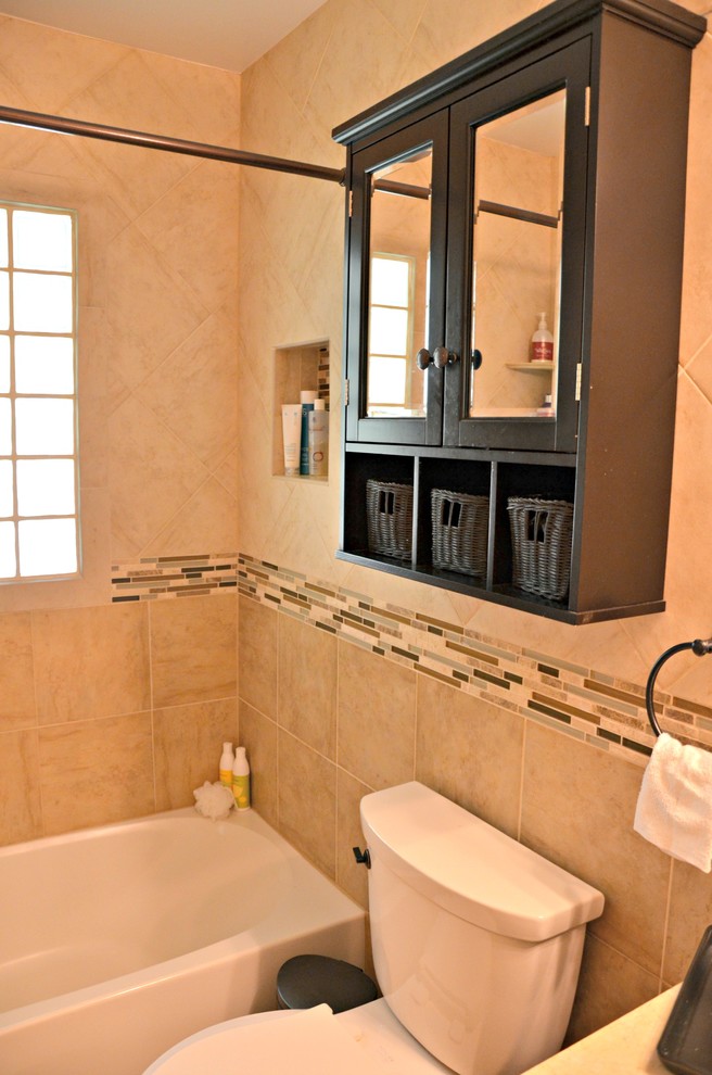 Photo of a mid-sized contemporary master bathroom in DC Metro with an undermount sink, furniture-like cabinets, dark wood cabinets, granite benchtops, an alcove tub, an alcove shower, a two-piece toilet, multi-coloured tile, mosaic tile, beige walls and ceramic floors.