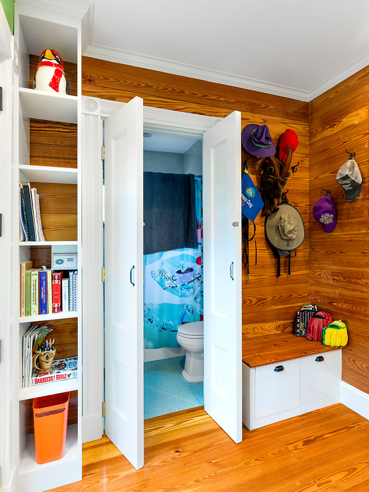 Small eclectic mudroom in Boston with brown walls, medium hardwood floors and brown floor.