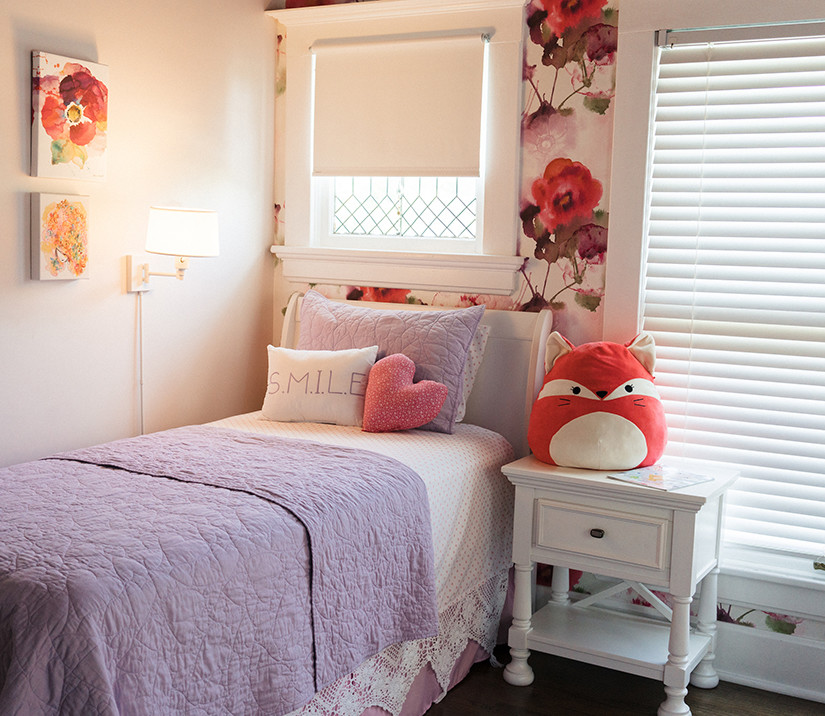 Mid-sized traditional guest bedroom in Other with pink walls, dark hardwood floors and brown floor.