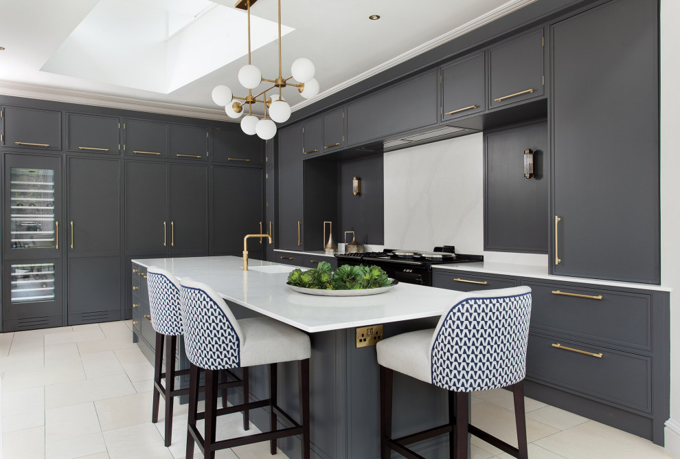 This is an example of a large transitional l-shaped eat-in kitchen in Dublin with a single-bowl sink, shaker cabinets, grey cabinets, quartzite benchtops, white splashback, stone slab splashback, black appliances, ceramic floors, with island, white floor and white benchtop.