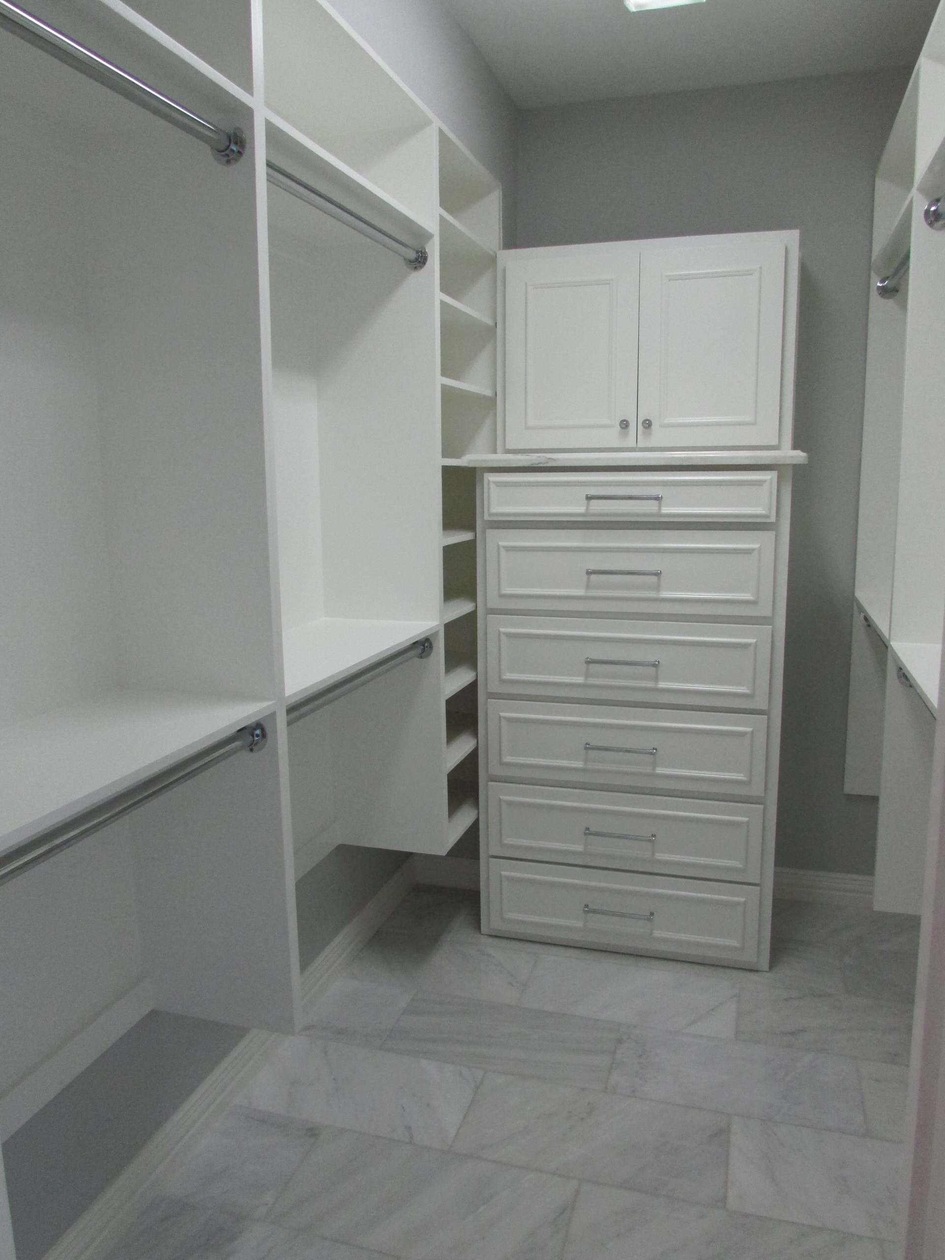 A dated Plano master bath received an updated look with a complete tear out, re-design and remodel with new custom cabinetry to include built-in dressers in closets, free standing tub with wall mounte