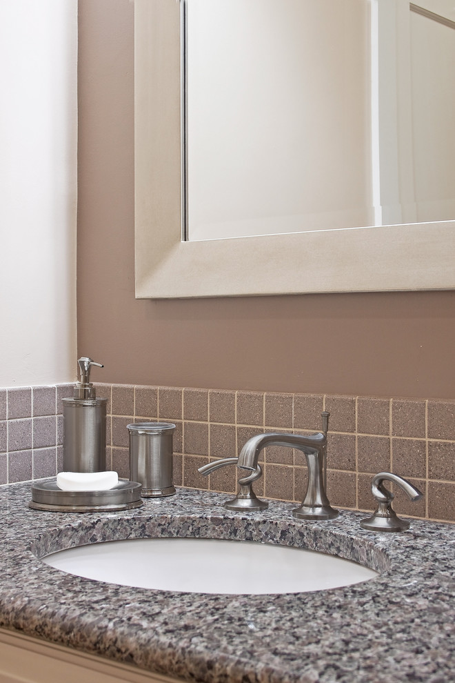 Example of a mid-sized transitional 3/4 gray tile and ceramic tile porcelain tile bathroom design with raised-panel cabinets, white cabinets, beige walls, an undermount sink and granite countertops