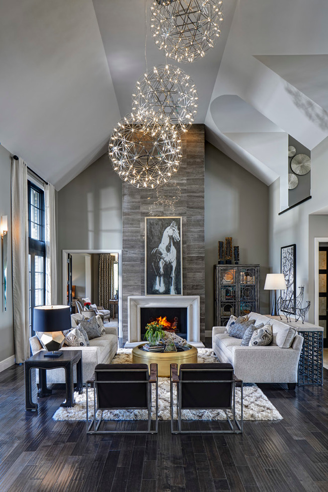 Transitional open concept living room in Detroit with grey walls and dark hardwood floors.