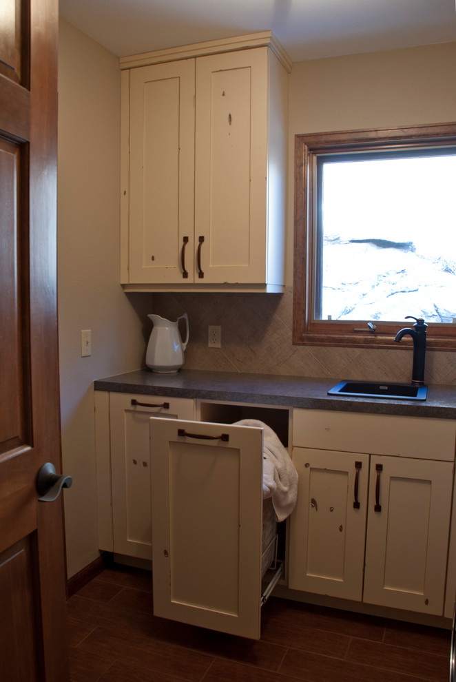 Traditional laundry room in Denver.