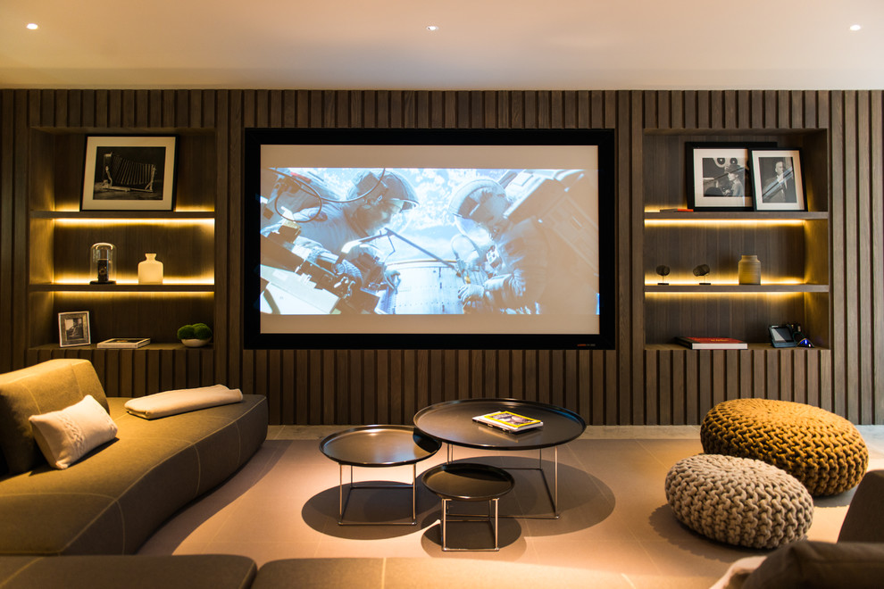 Mid-sized contemporary home theatre in London with brown walls and beige floor.