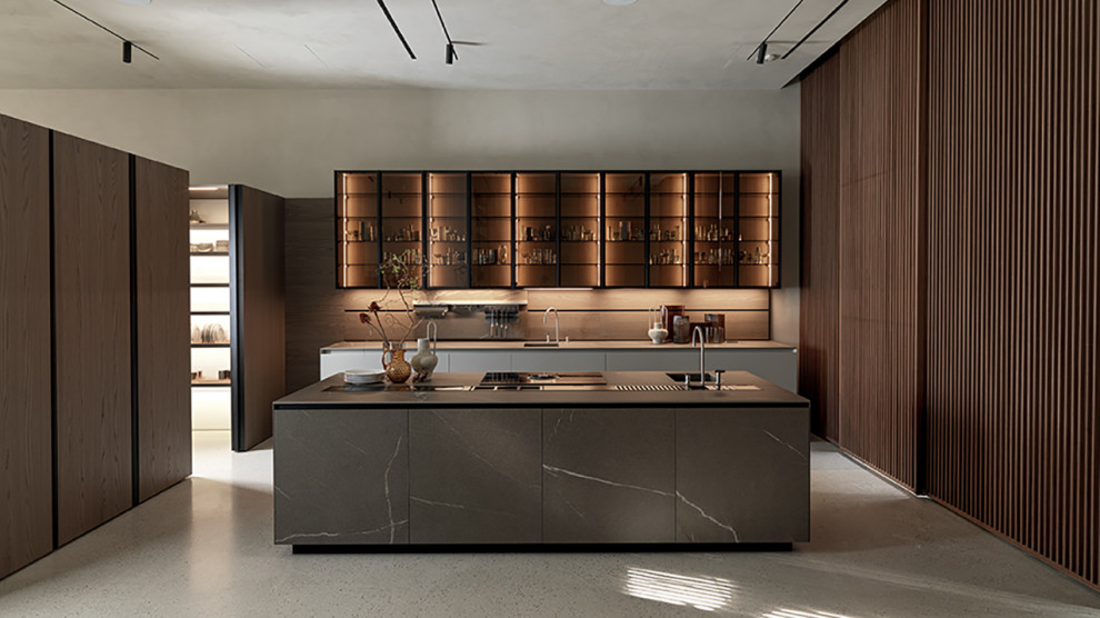 This is an example of a large modern u-shaped eat-in kitchen in Los Angeles with a single-bowl sink, flat-panel cabinets, brown cabinets, solid surface benchtops, brown splashback, porcelain splashback, panelled appliances, cement tiles, with island, grey floor and brown benchtop.
