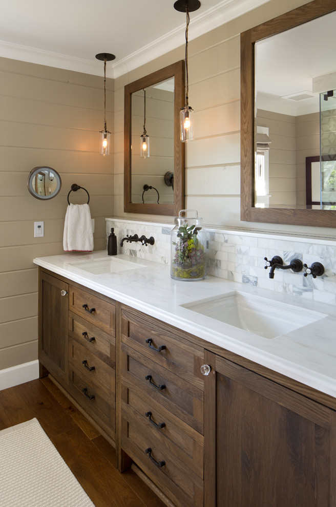 Bathroom - farmhouse white tile and stone tile bathroom idea in San Diego with dark wood cabinets, brown walls and white countertops