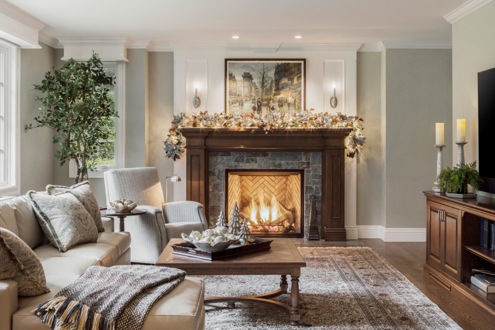 Example of a classic enclosed dark wood floor and brown floor living room design in San Francisco with gray walls, a standard fireplace and a wall-mounted tv