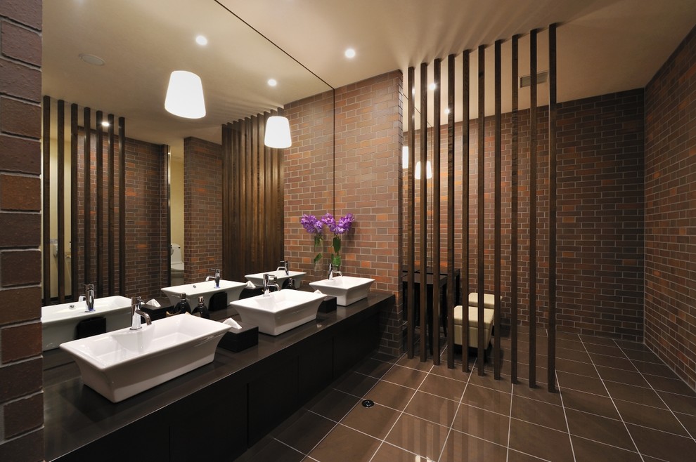 Inspiration for a contemporary bathroom remodel in Other with a vessel sink