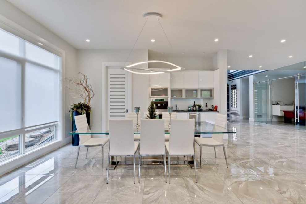 Kitchen/dining room combo - large modern ceramic tile and beige floor kitchen/dining room combo idea in Edmonton with white walls and no fireplace