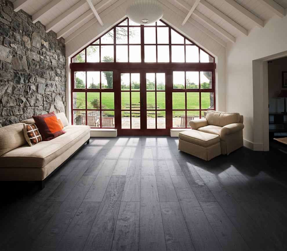 Inspiration for a large country open concept family room in Other with white walls and dark hardwood floors.