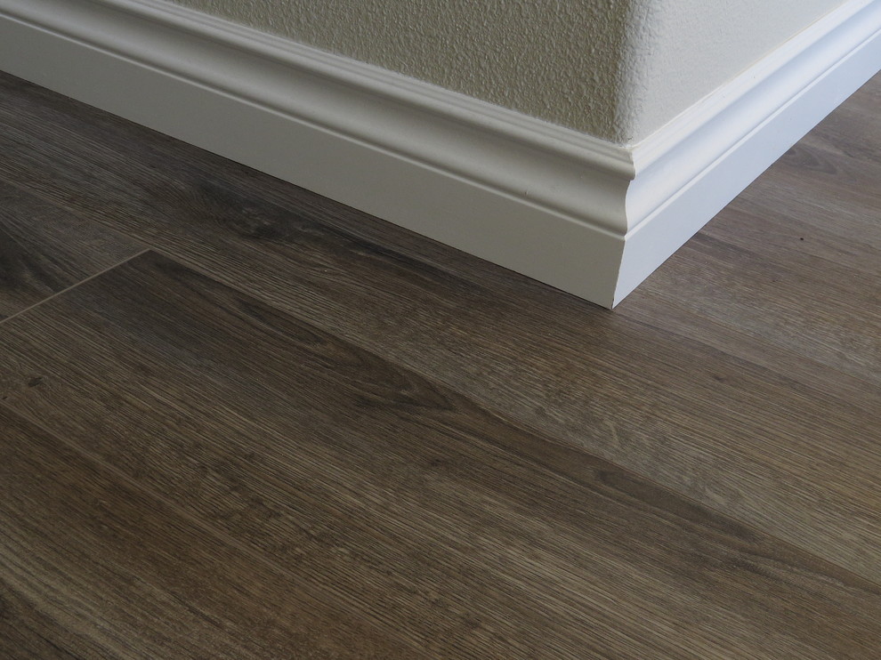 Example of a mid-sized transitional medium tone wood floor hallway design with beige walls