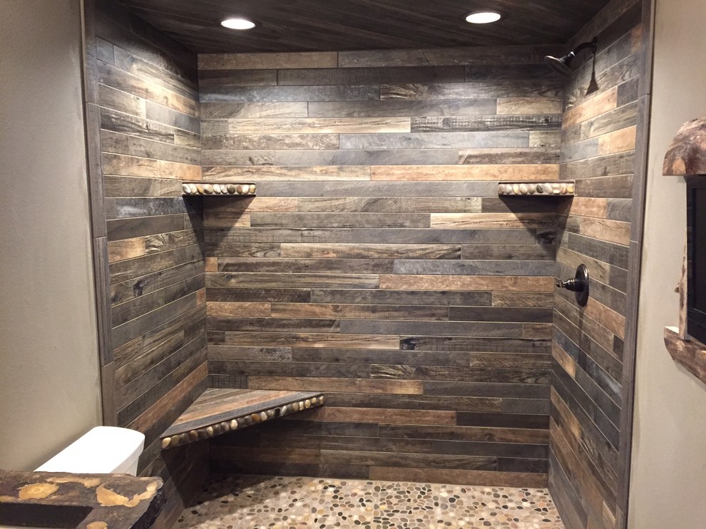 Doorless shower - small rustic master multicolored tile and porcelain tile porcelain tile and gray floor doorless shower idea with shaker cabinets, medium tone wood cabinets, brown walls and concrete countertops