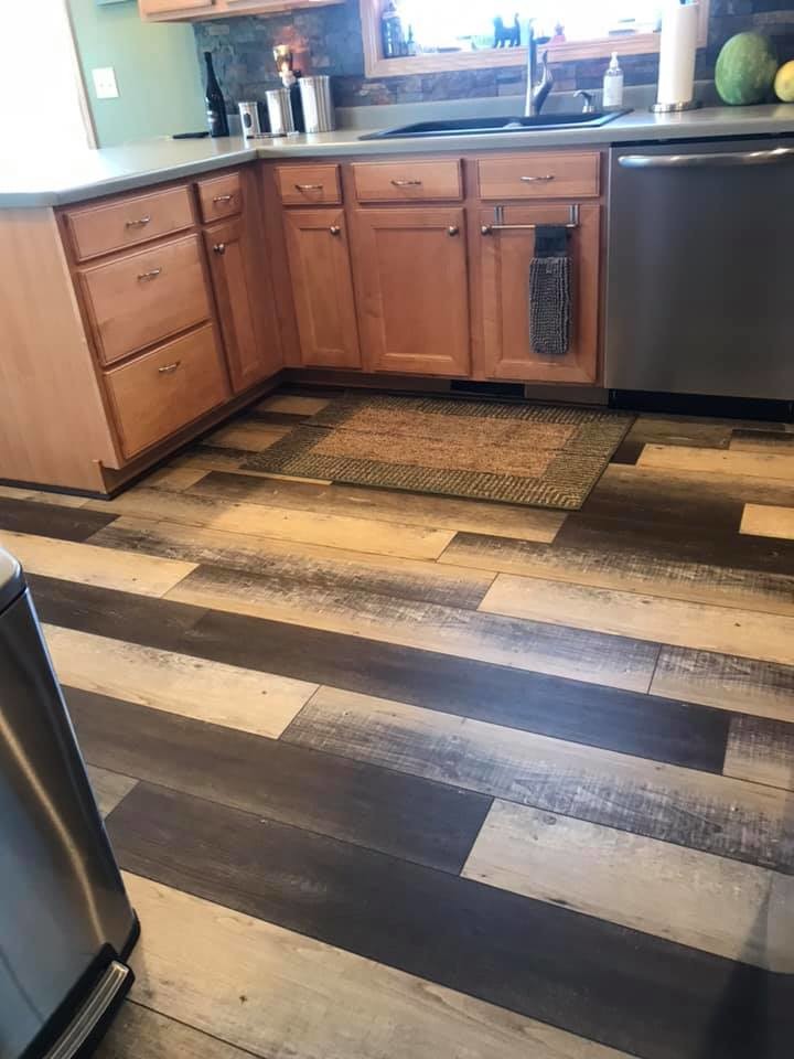 Kitchen - mid-sized transitional vinyl floor and multicolored floor kitchen idea with a drop-in sink, flat-panel cabinets, light wood cabinets, laminate countertops, stone tile backsplash and stainless steel appliances