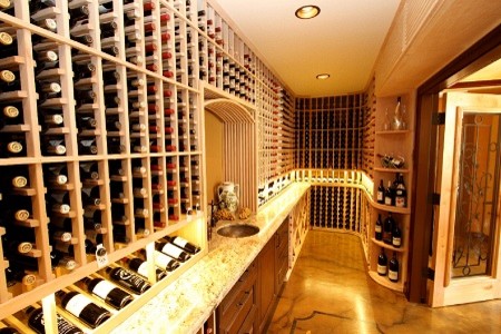 This is an example of a mid-sized tropical wine cellar in Hawaii with display racks.