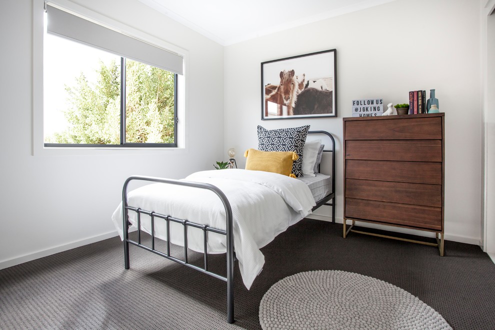 Photo of a contemporary kids' room in Melbourne with white walls, carpet and grey floor.