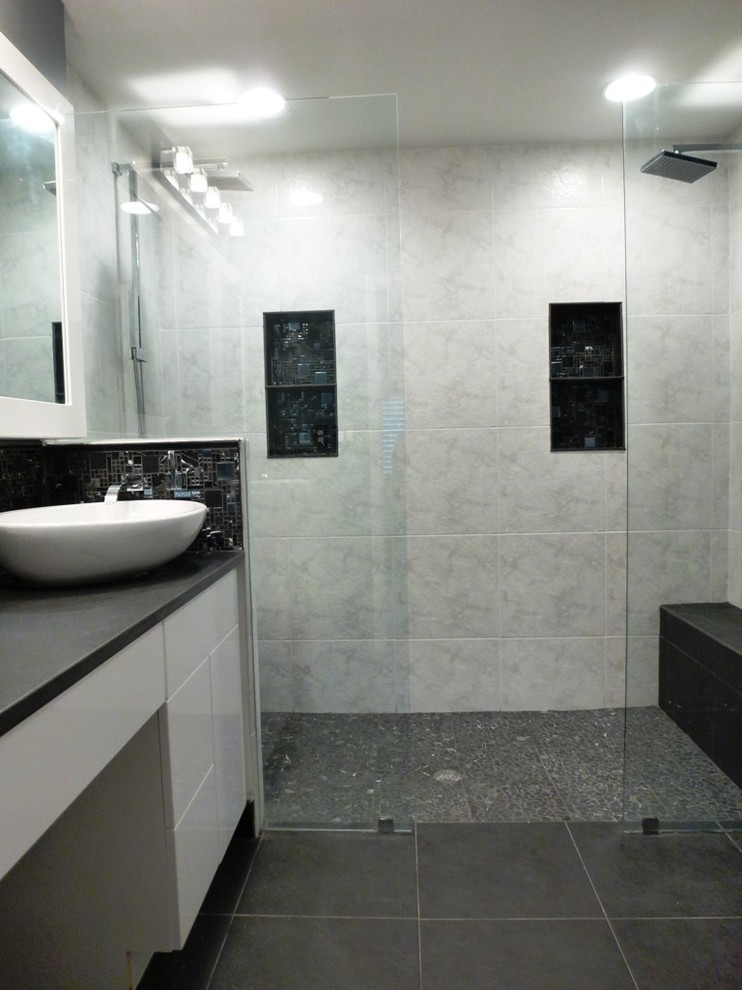 Inspiration for a small contemporary master bathroom in Miami with a vessel sink, flat-panel cabinets, white cabinets, granite benchtops, a double shower, white tile, stone tile, grey walls and slate floors.