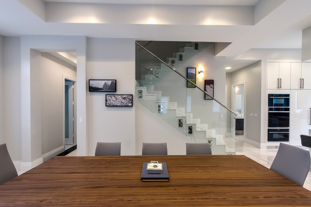 Example of a transitional home design design in Miami