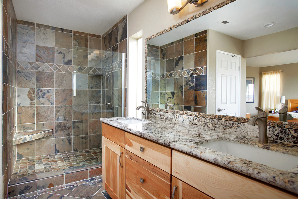 Large country master bathroom in San Diego with an undermount sink, shaker cabinets, light wood cabinets, granite benchtops, a corner shower, a one-piece toilet, brown tile, stone tile, beige walls and slate floors.