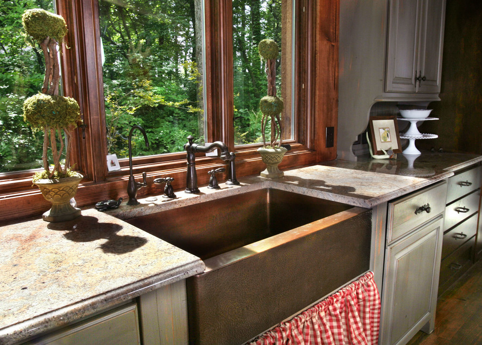 Eat-in kitchen - large rustic l-shaped brown floor and dark wood floor eat-in kitchen idea in Indianapolis with a farmhouse sink, window backsplash, recessed-panel cabinets, dark wood cabinets, granite countertops, stainless steel appliances, an island and beige countertops