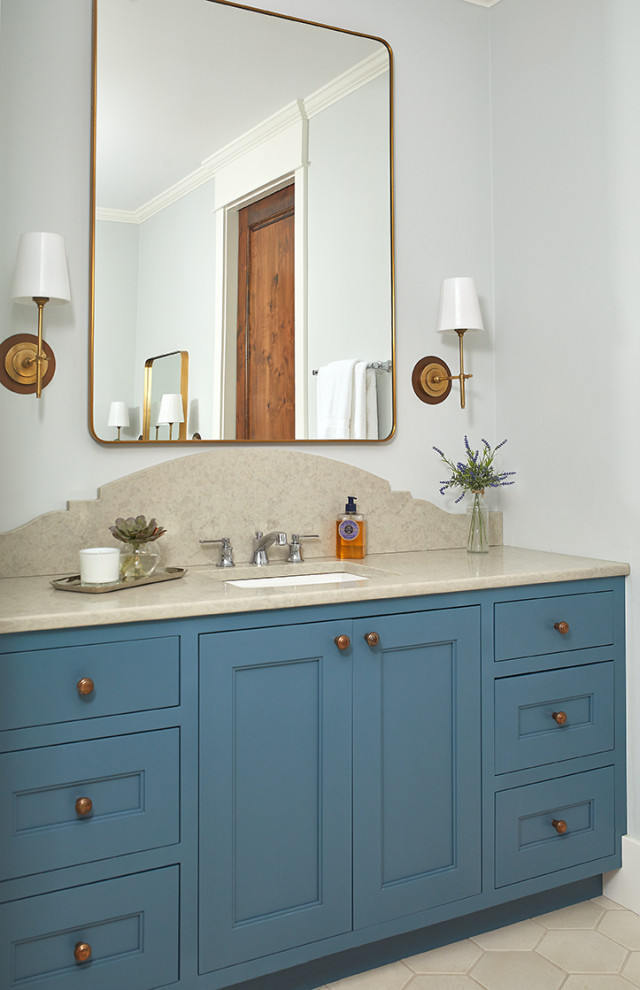 Inspiration for a small beach style master bathroom in Grand Rapids with recessed-panel cabinets, blue cabinets, grey walls, ceramic floors, an undermount sink, limestone benchtops, beige floor and beige benchtops.