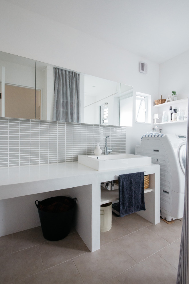 This is an example of a contemporary powder room in Other with white cabinets, gray tile, porcelain tile, white walls, vinyl floors and a vessel sink.