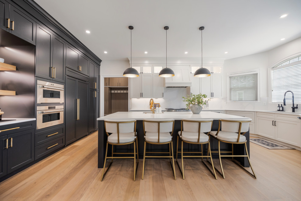 Example of a large transitional u-shaped eat-in kitchen design in DC Metro