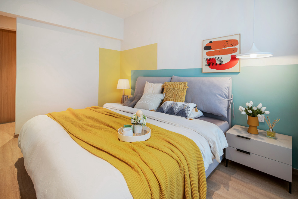 This is an example of a scandi grey and yellow bedroom in Singapore.