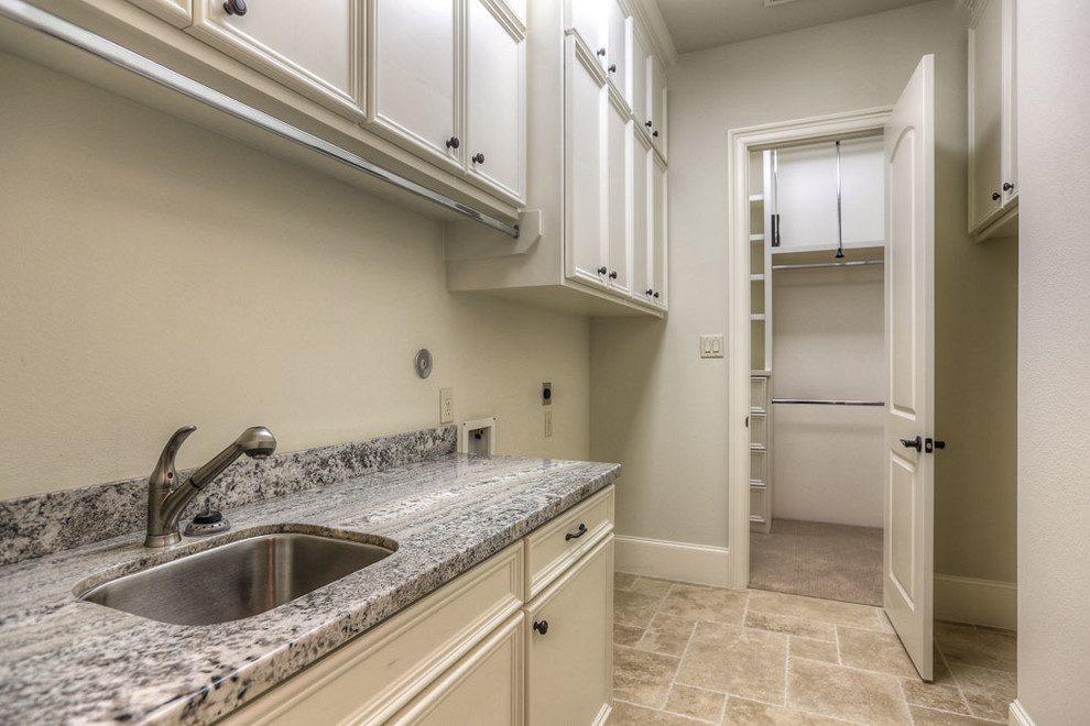 Photo of a transitional laundry room in Houston.