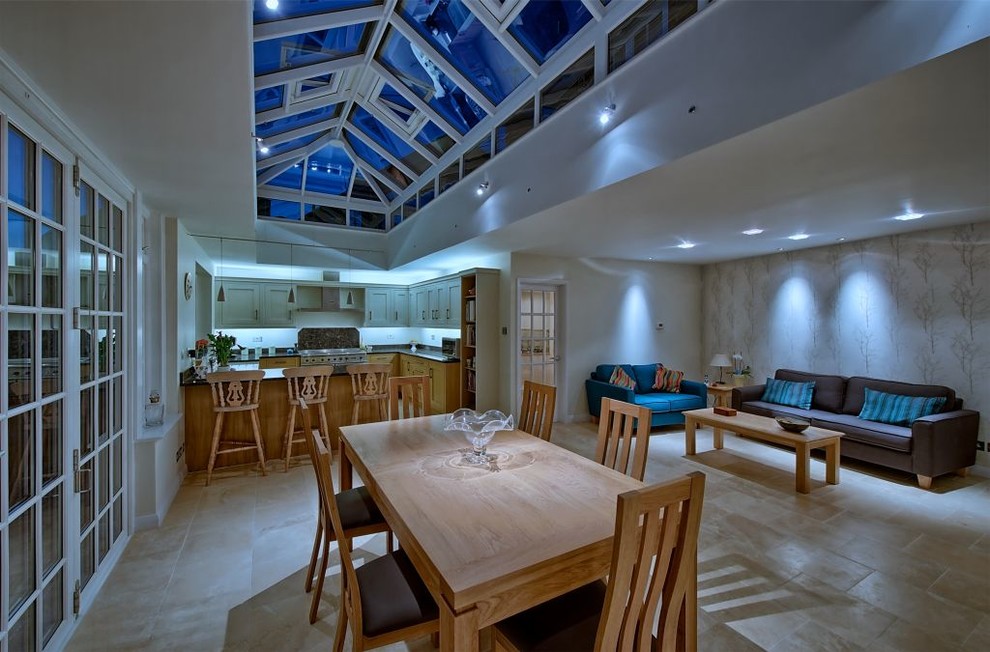 Photo of a medium sized classic open plan dining room in Cambridgeshire with white walls and terracotta flooring.