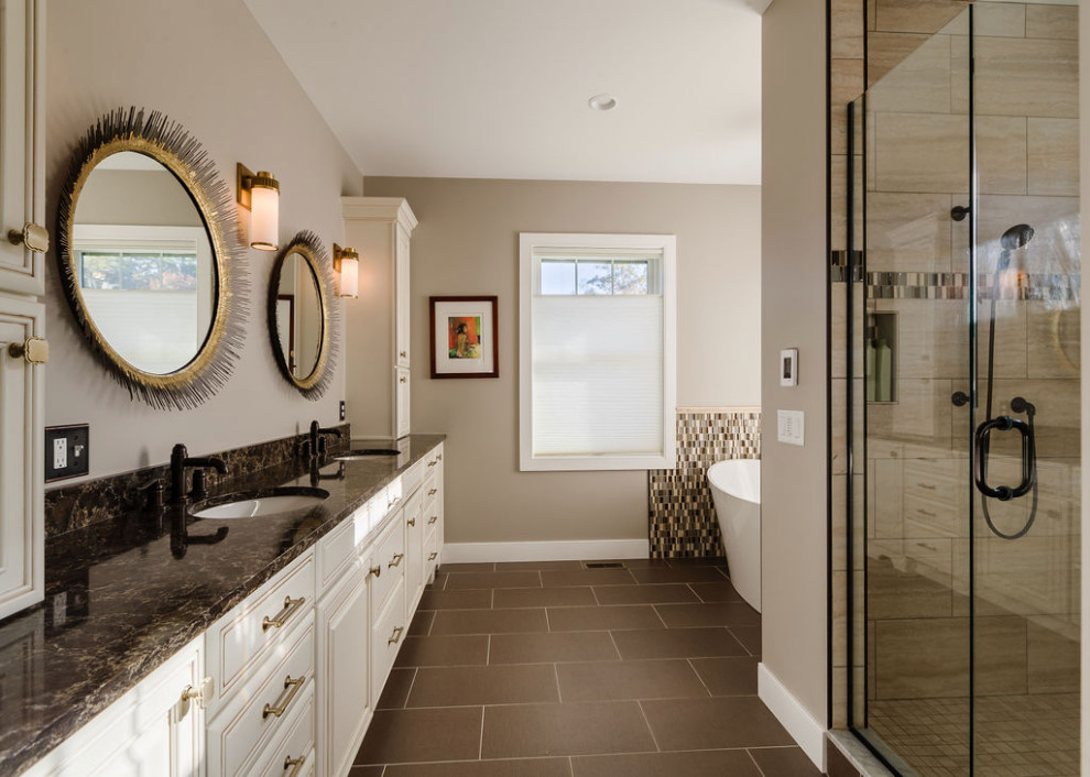 Photo of a traditional master bathroom in Other with a freestanding tub, a hinged shower door, a niche, a double vanity and a built-in vanity.