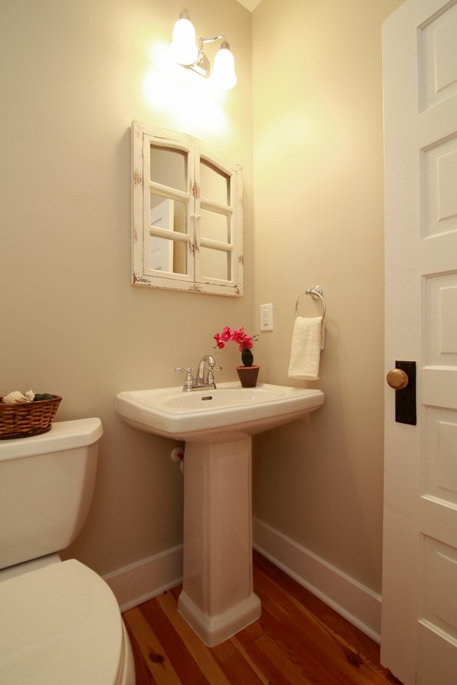 Design ideas for an arts and crafts powder room in Raleigh.