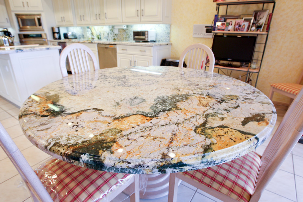 Example of a large transitional galley ceramic tile eat-in kitchen design in Miami with a double-bowl sink, raised-panel cabinets, white cabinets, granite countertops, multicolored backsplash, stone slab backsplash, stainless steel appliances and an island