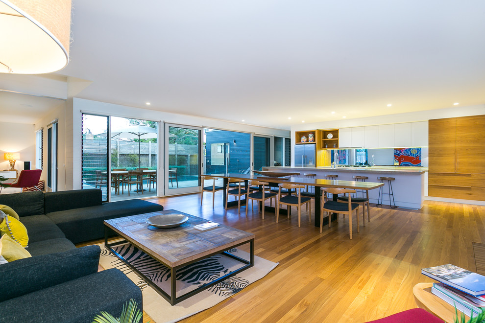 This is an example of a mid-sized contemporary open concept living room in Melbourne.