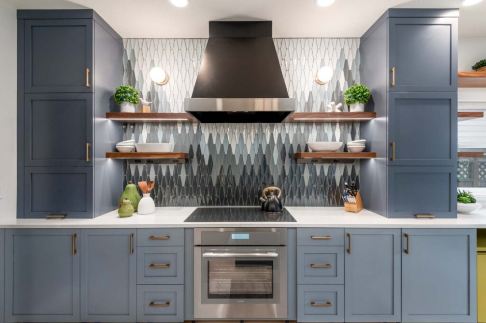 Kitchen - transitional galley vinyl floor and gray floor kitchen idea with an undermount sink, shaker cabinets, blue cabinets, quartz countertops, multicolored backsplash, ceramic backsplash, stainless steel appliances, a peninsula and white countertops