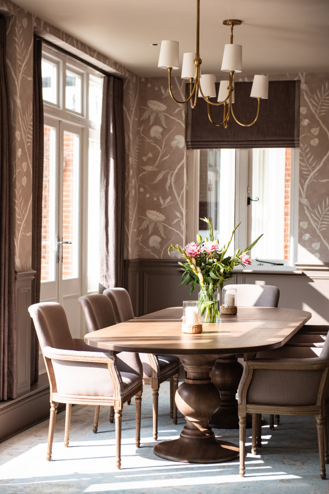 This is an example of a medium sized traditional enclosed dining room in Sussex with beige walls, medium hardwood flooring, beige floors, wallpapered walls and a dado rail.