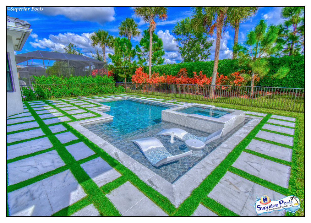 Mid-sized modern courtyard custom-shaped natural pool in Tampa with a pool house and decking.