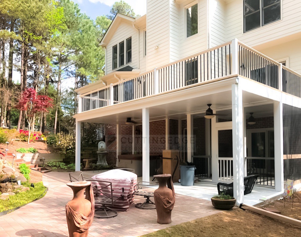 Expansive transitional backyard and first floor deck in Atlanta with with privacy feature, no cover and metal railing.
