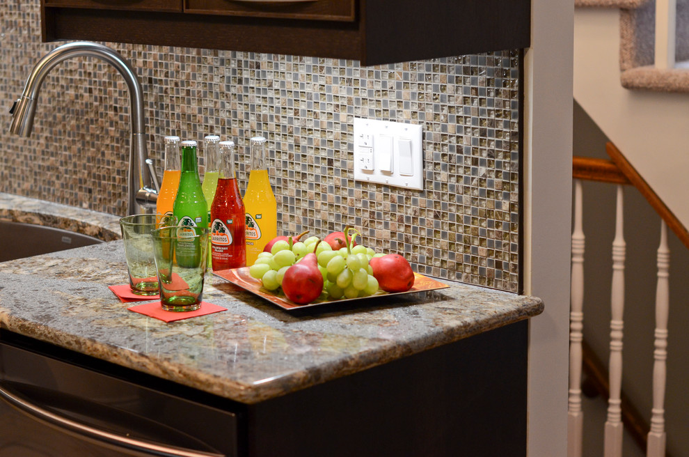 Home design - mid-sized transitional galley porcelain tile home design idea in Ottawa with an undermount sink, glass-front cabinets, brown cabinets, quartz countertops, brown backsplash, glass sheet backsplash and stainless steel appliances