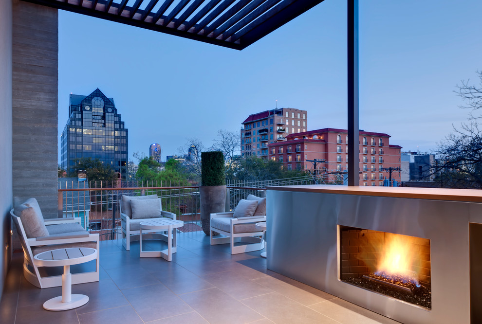 Inspiration for a contemporary deck in Dallas with a fire feature.
