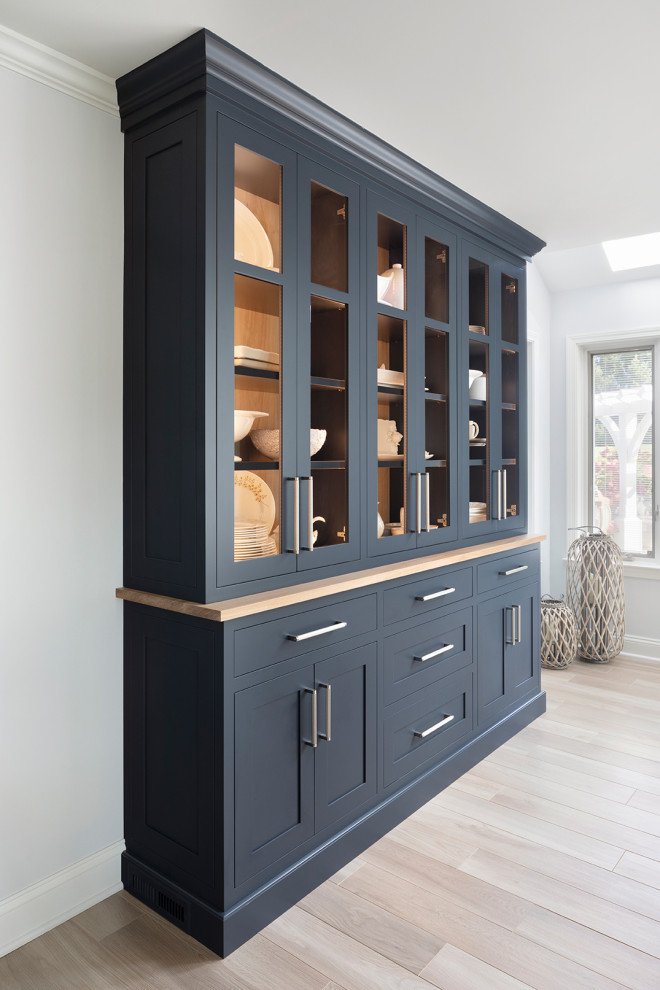 Example of a mid-sized transitional porcelain tile and beige floor kitchen/dining room combo design in Bridgeport with white walls