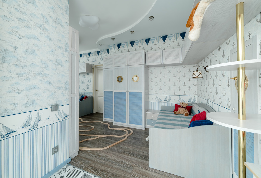Inspiration for a beach style kids' bedroom for kids 4-10 years old in Other with blue walls and medium hardwood floors.