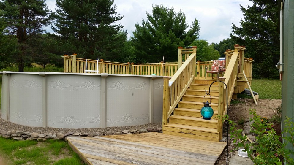 Mid-sized eclectic backyard deck photo